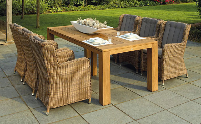 Wicker patio chairs on ceramic tile floor